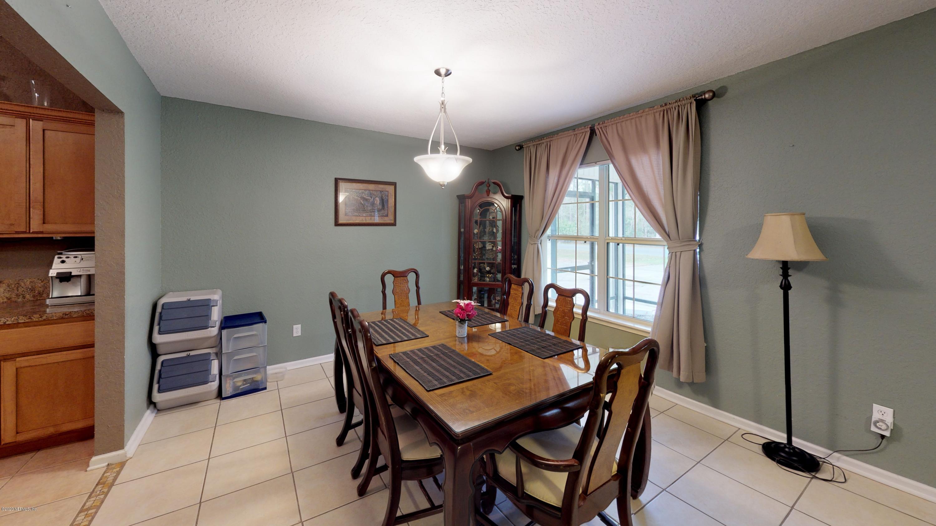 3990 Bronco Road Middleburg, FL 32068 - Photo 29 of 40 a view of a dining room with furniture window and outside view