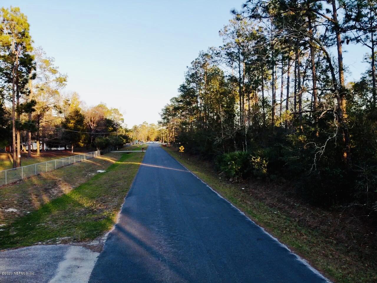 3990 Bronco Road Middleburg, FL 32068 - Photo 38 of 40 a view of street with with lots of green space and trees