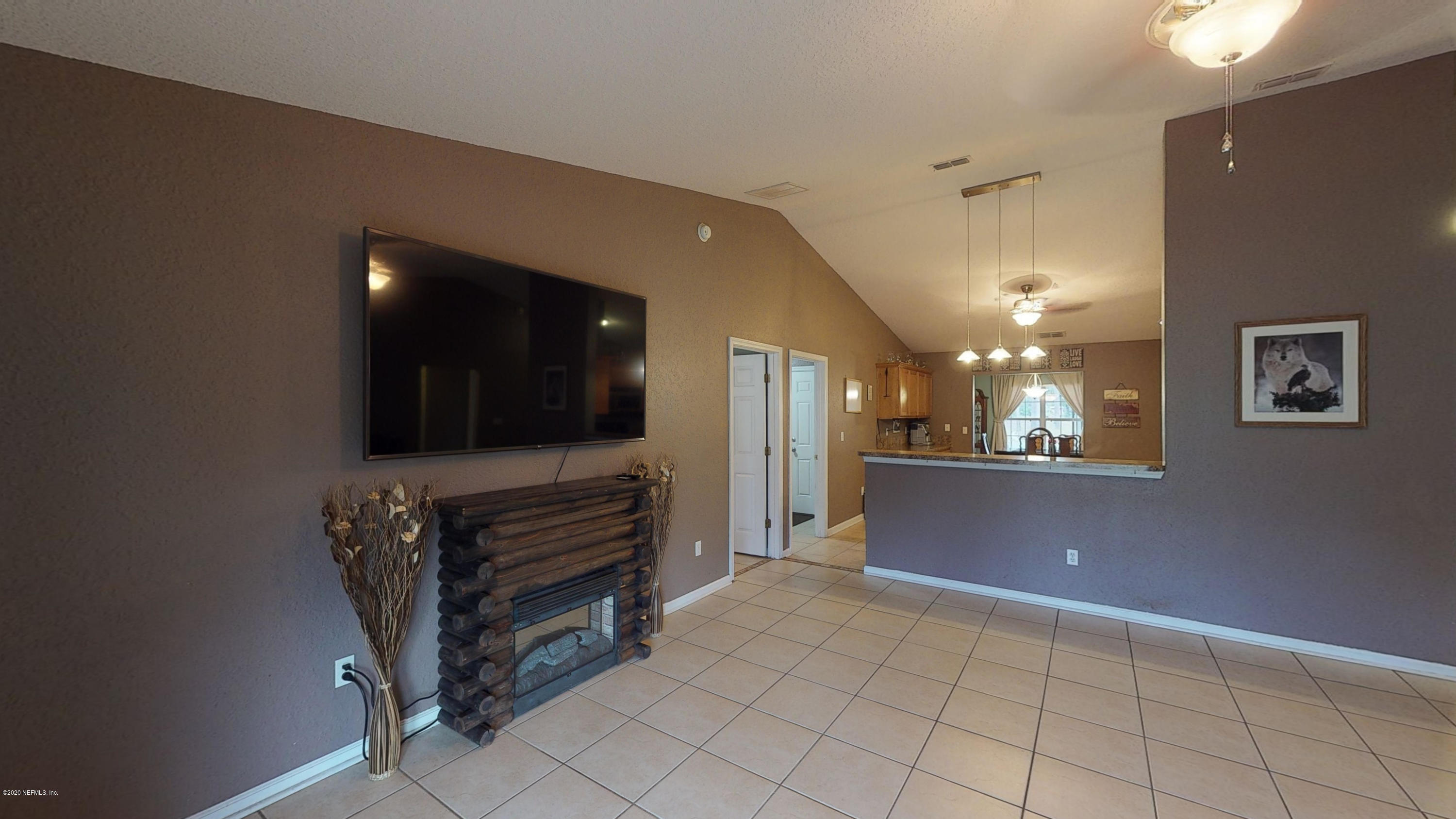3990 Bronco Road Middleburg, FL 32068 - Photo 5 of 40 a view of kitchen with cabinets and furniture