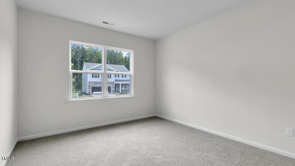 812 Comice Pear Way Willow Spring, NC 27592 - Photo 16 of 42 an empty room with a window