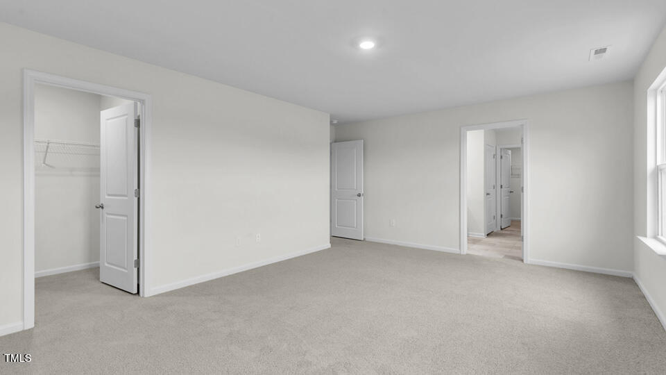 812 Comice Pear Way Willow Spring, NC 27592 - Photo 17 of 42 a view of an empty room and closet area