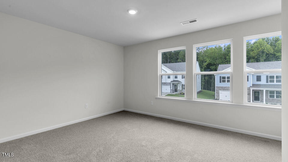 812 Comice Pear Way Willow Spring, NC 27592 - Photo 21 of 42 an empty room with a window