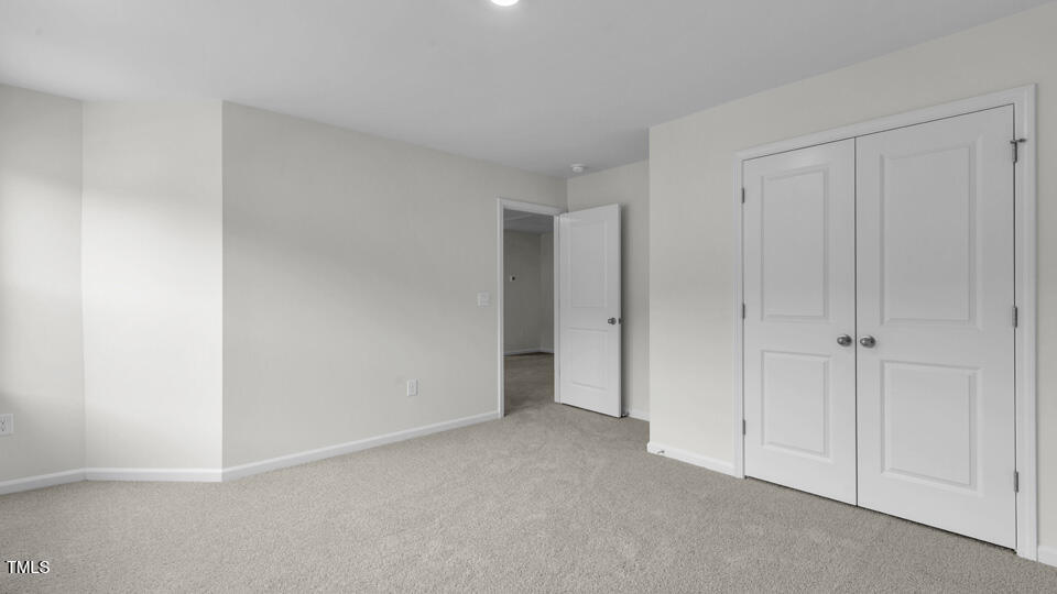 812 Comice Pear Way Willow Spring, NC 27592 - Photo 25 of 42 a view of an empty room and closet area
