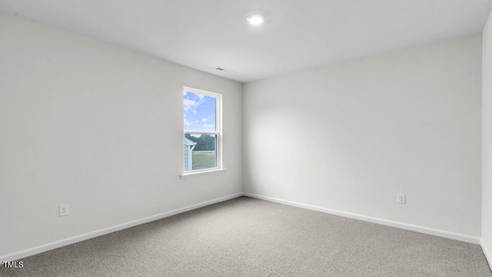 812 Comice Pear Way Willow Spring, NC 27592 - Photo 27 of 42 an empty room with a window