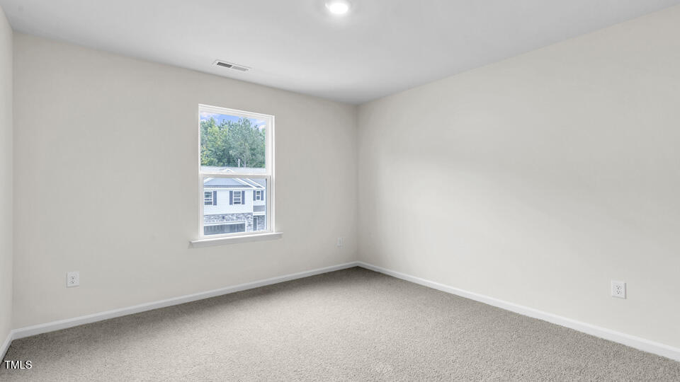 812 Comice Pear Way Willow Spring, NC 27592 - Photo 29 of 42 an empty room with a window