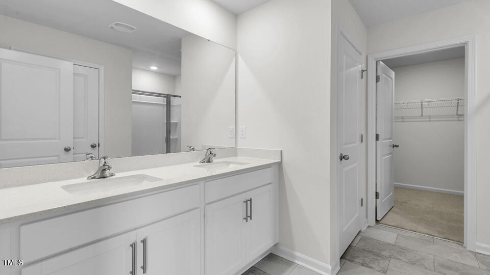 812 Comice Pear Way Willow Spring, NC 27592 - Photo 30 of 42 a bathroom with a double vanity sink mirror and shower