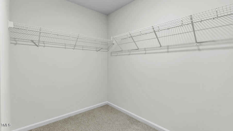 812 Comice Pear Way Willow Spring, NC 27592 - Photo 33 of 42 a view of a room with racks on the wall