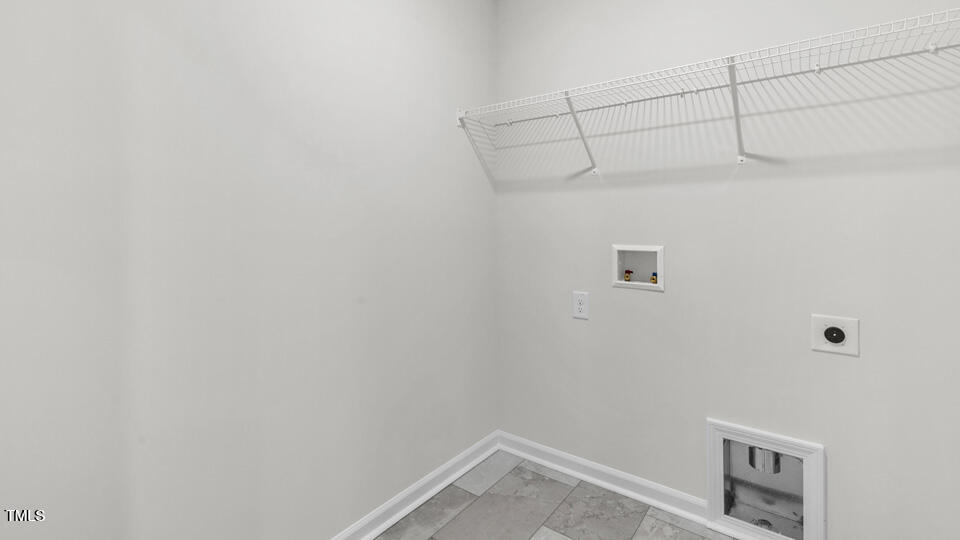 812 Comice Pear Way Willow Spring, NC 27592 - Photo 35 of 42 a view of a room with racks on the wall