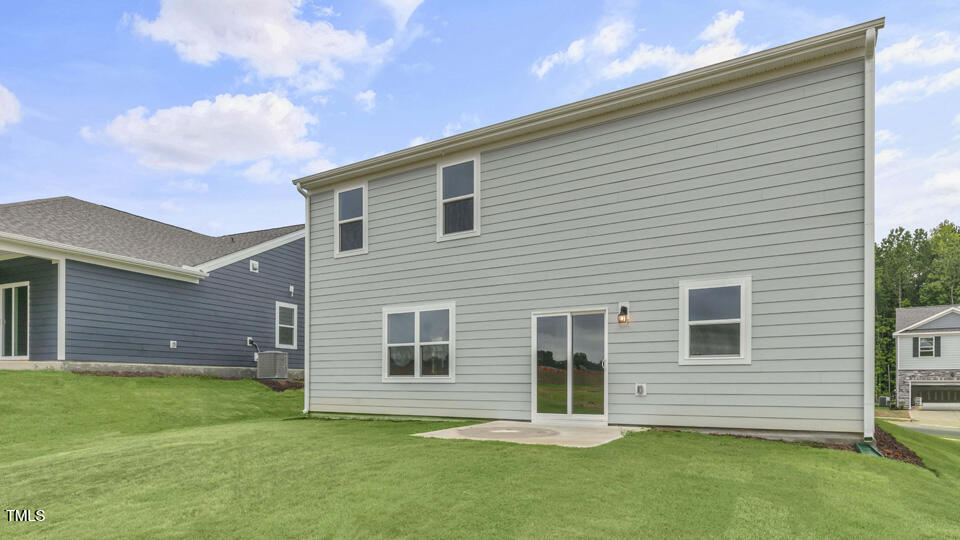 812 Comice Pear Way Willow Spring, NC 27592 - Photo 39 of 42 a front view of a house with a garden