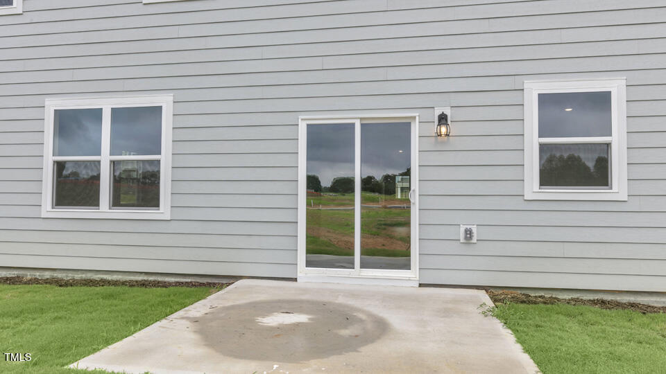 812 Comice Pear Way Willow Spring, NC 27592 - Photo 40 of 42 a front view of a house with a garden