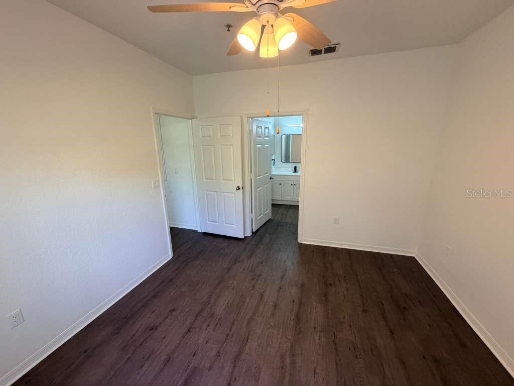 825 Grand Regency Point, Unit 102 Altamonte Springs, FL 32714 - Photo 12 of 29 wooden floor in an empty room