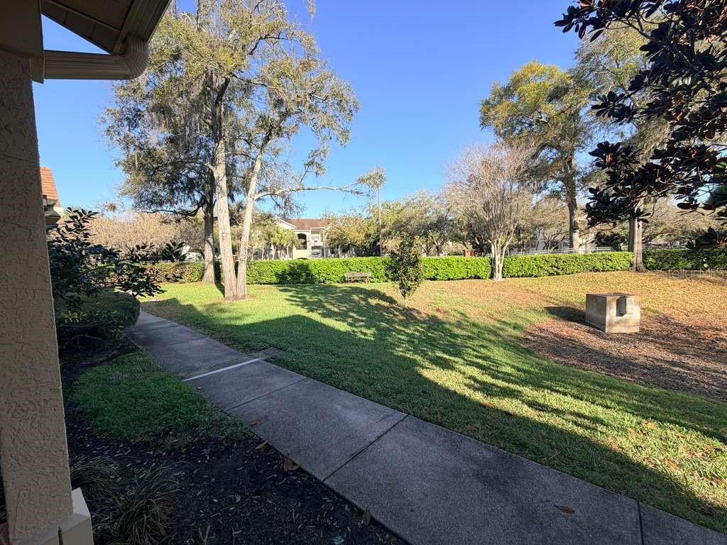 825 Grand Regency Point, Unit 102 Altamonte Springs, FL 32714 - Photo 27 of 29 a view of a yard with flower plants