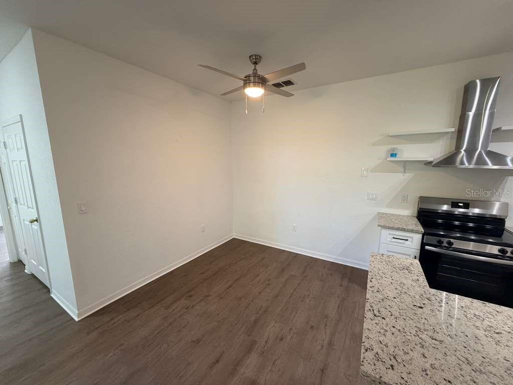 825 Grand Regency Point, Unit 102 Altamonte Springs, FL 32714 - Photo 10 of 29 a kitchen with a stove and a refrigerator