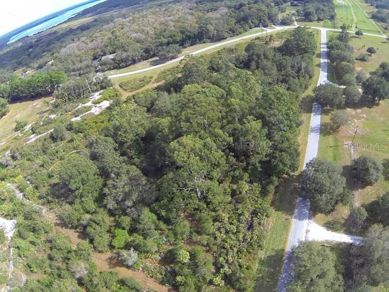 0 Sheps Island Road Sarasota, FL 34241 - Photo 1 of 1 Aerial View - Looking east along Sheps Iland Rd., towards Old Ranch Rd. The cleared trail on the lift side of the illustration is the western boundary of this 7-acre lot.