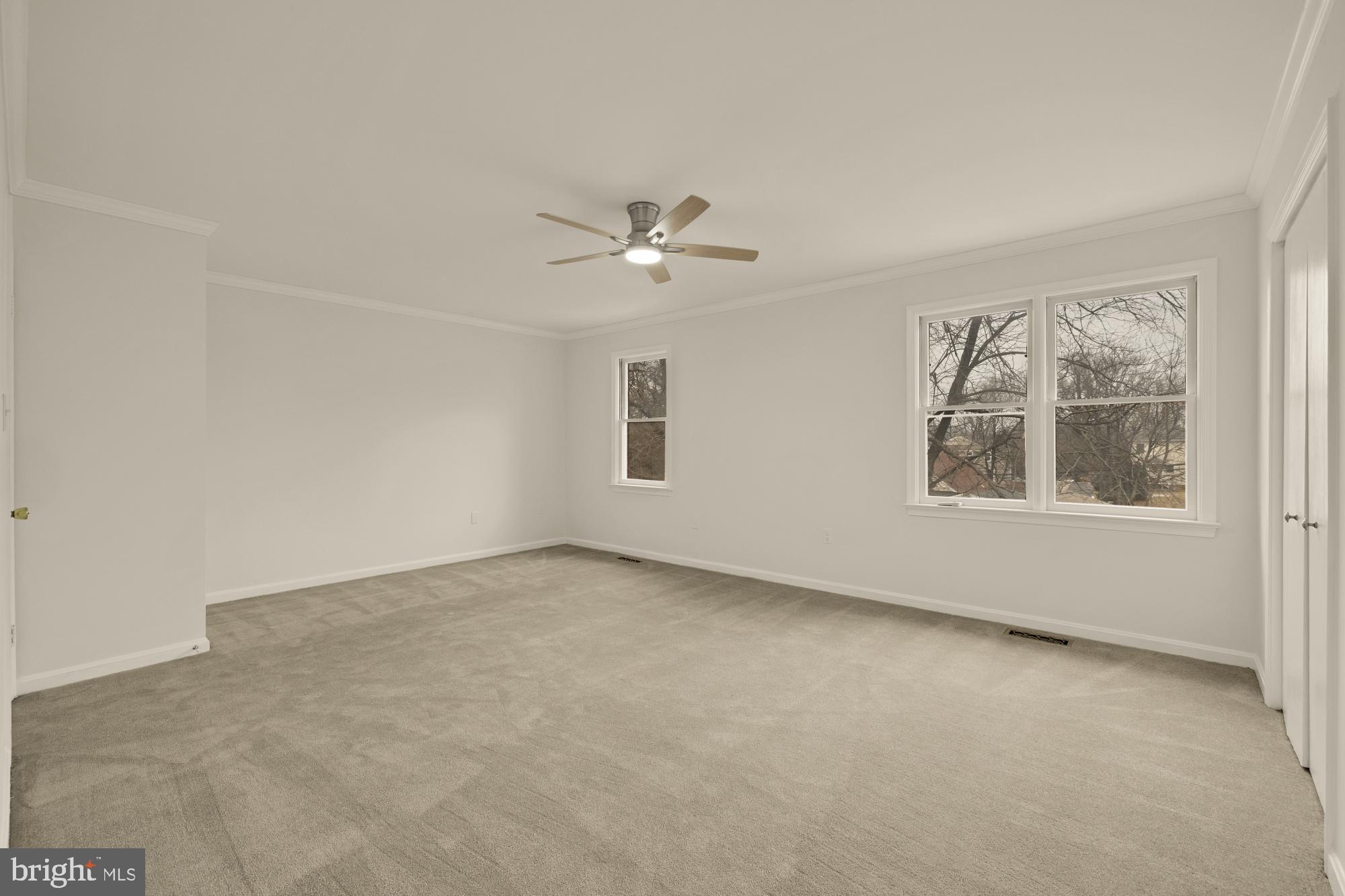 2 Spindrift Way Annapolis, MD 21403 - Photo 21 of 39 an empty room with windows and ceiling fan view