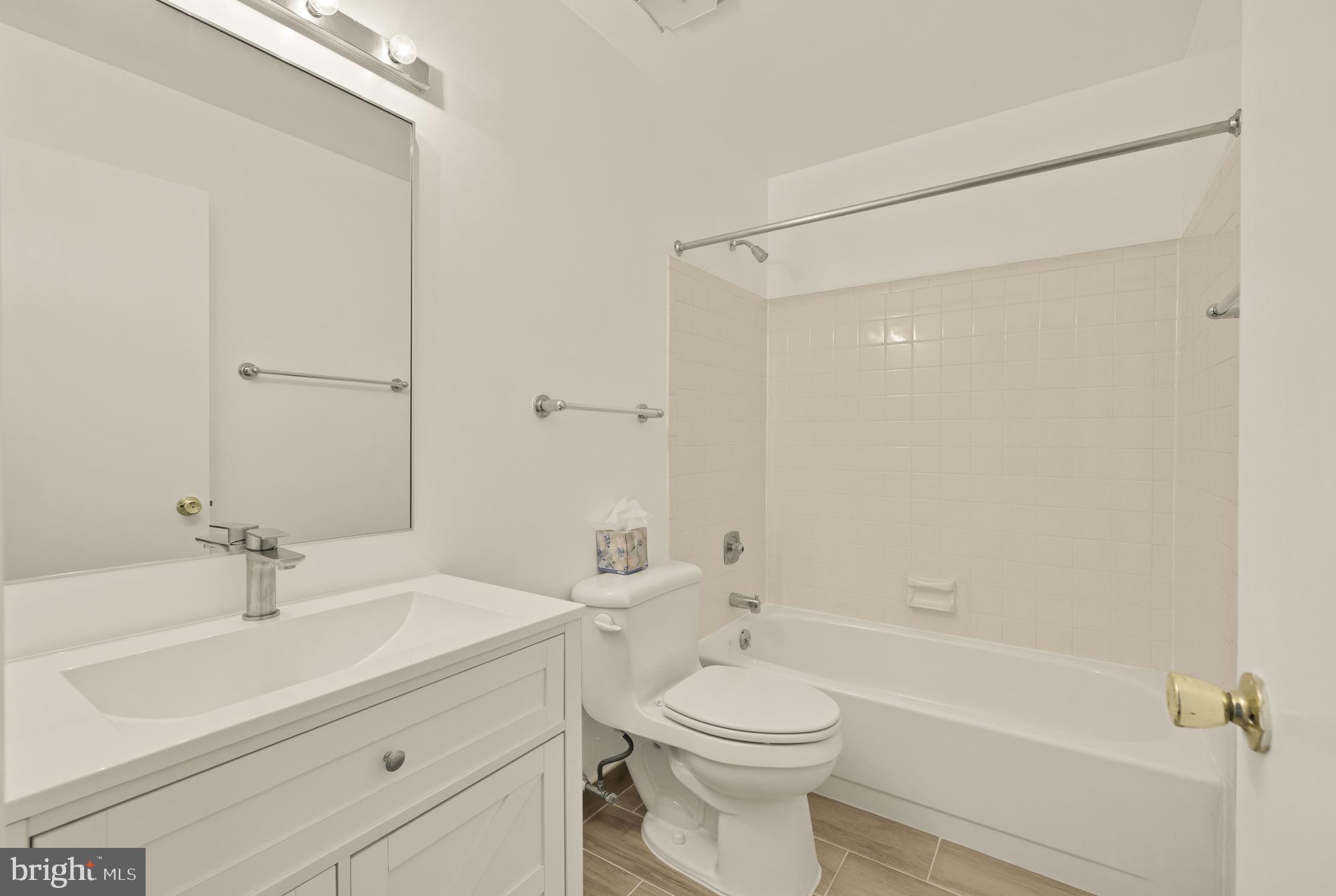 2 Spindrift Way Annapolis, MD 21403 - Photo 26 of 39 a bathroom with a sink a toilet and shower