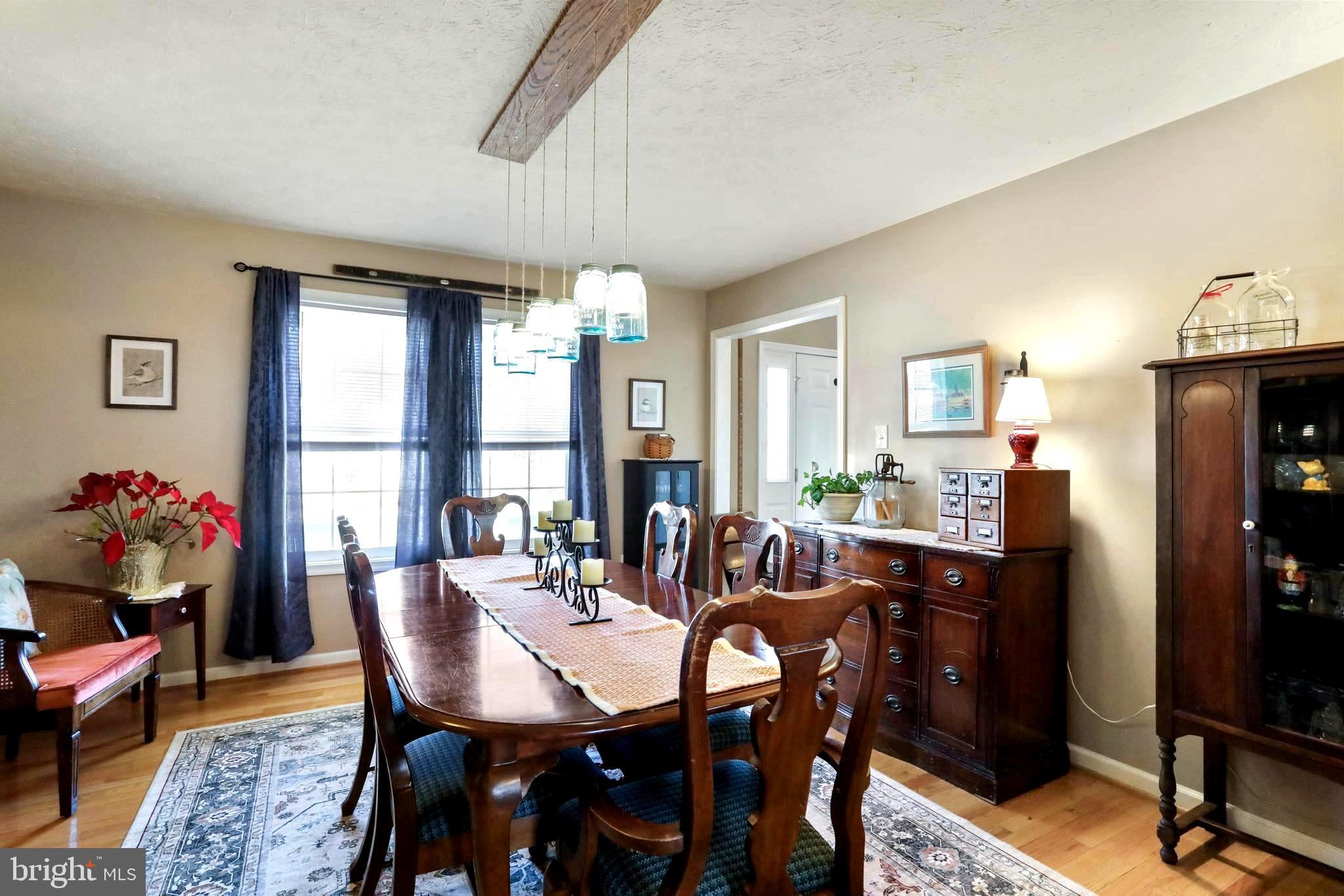1147 Happy Ridge Drive Front Royal, VA 22630 - Photo 14 of 42 a view of a dining room with furniture and a window