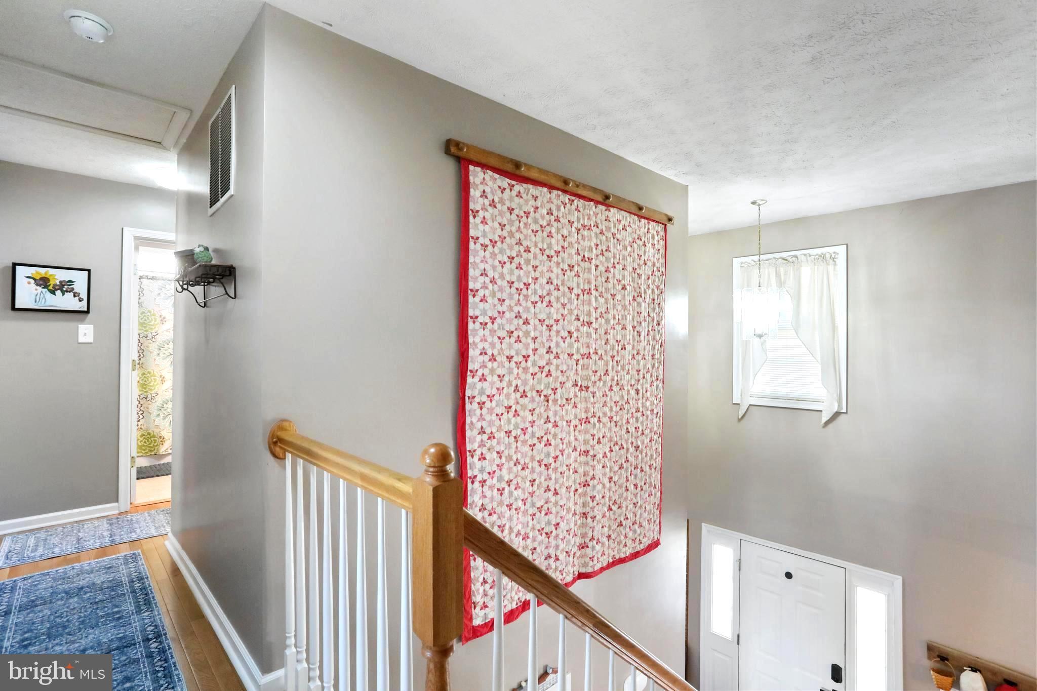 1147 Happy Ridge Drive Front Royal, VA 22630 - Photo 17 of 42 a view of a hallway with windows