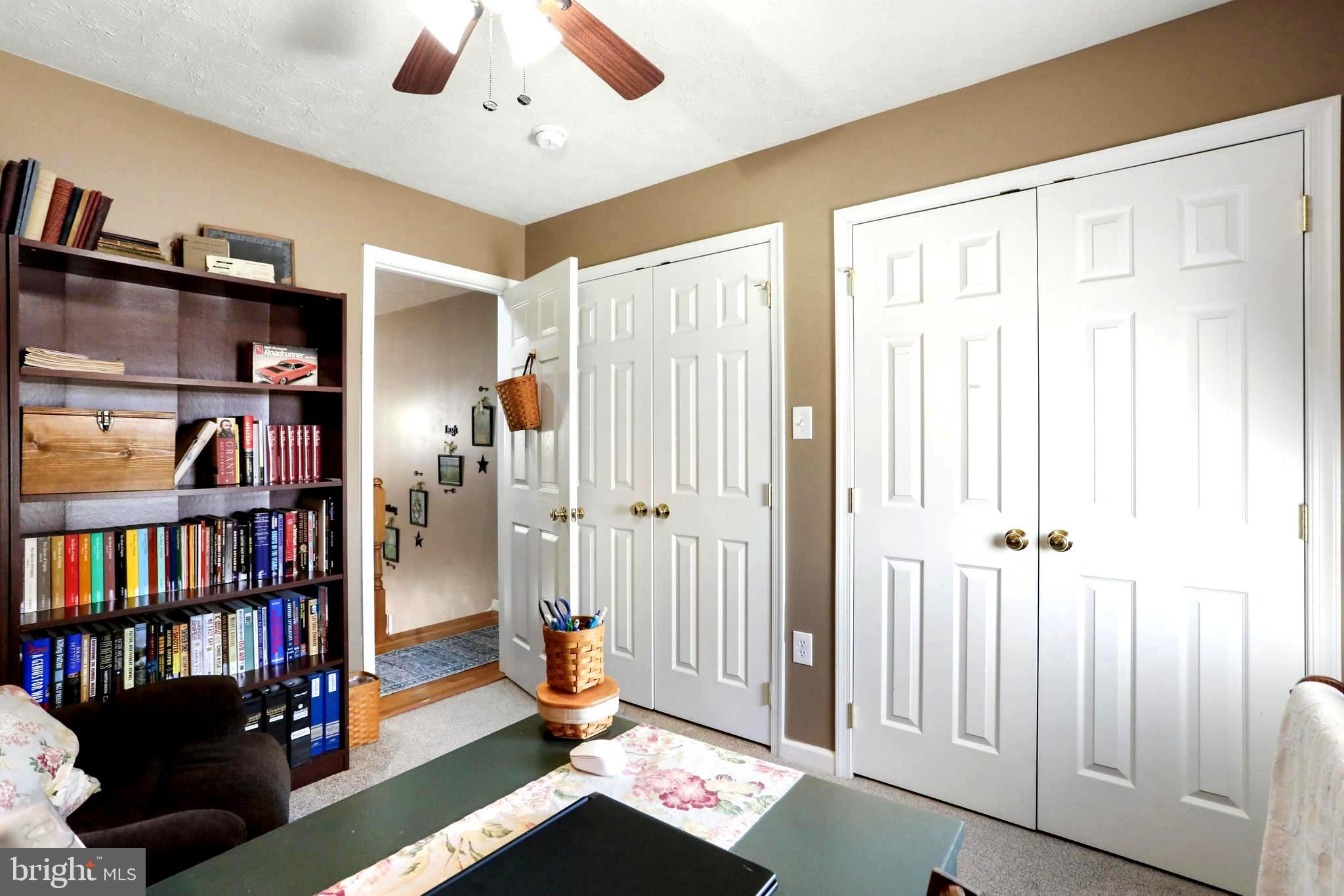 1147 Happy Ridge Drive Front Royal, VA 22630 - Photo 21 of 42 a view of a livingroom with a bookshelf and a window