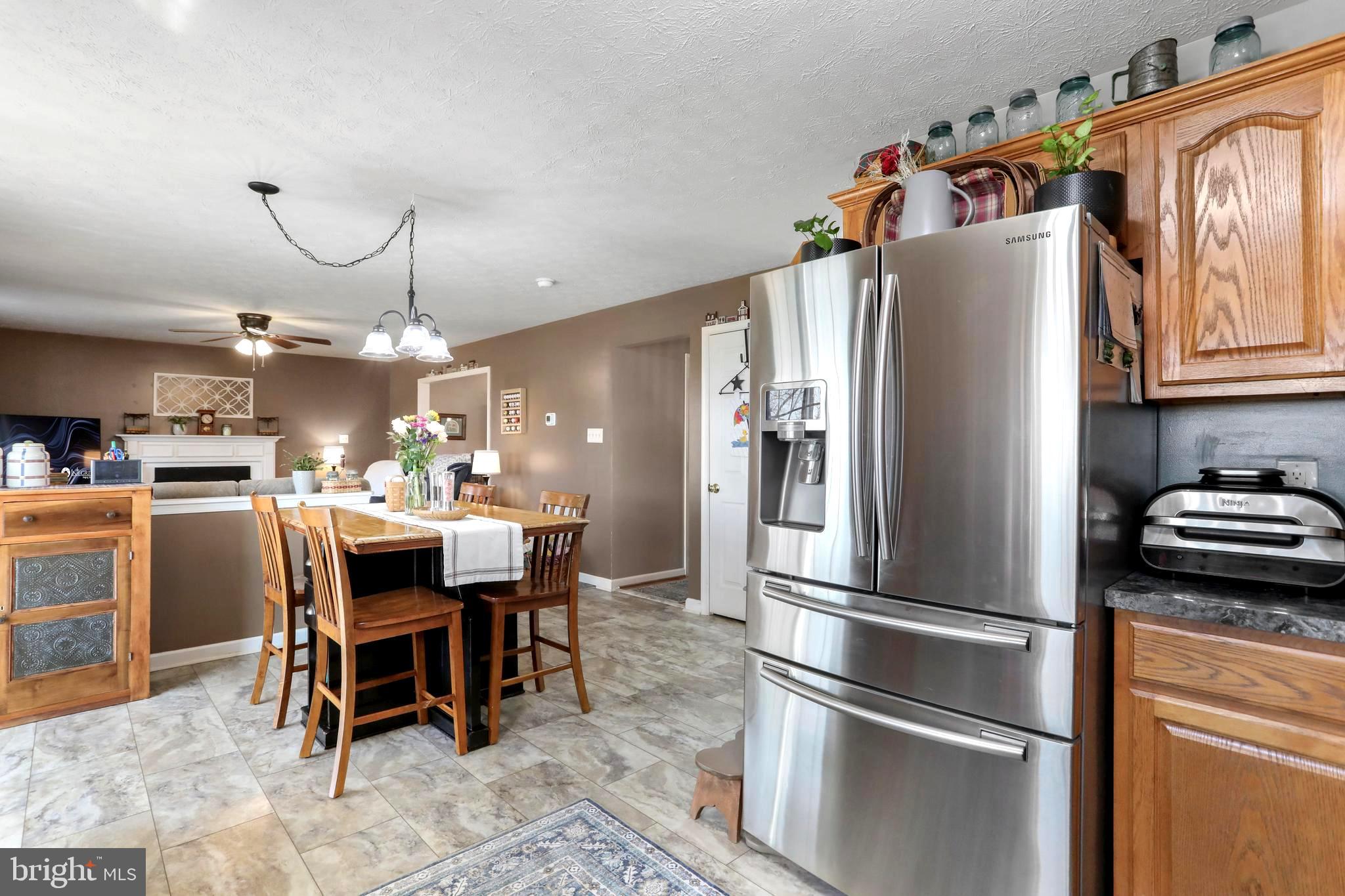 1147 Happy Ridge Drive Front Royal, VA 22630 - Photo 25 of 42 a kitchen with stainless steel appliances granite countertop a refrigerator and microwave