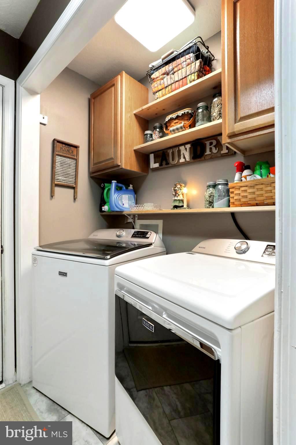 1147 Happy Ridge Drive Front Royal, VA 22630 - Photo 26 of 42 a kitchen with stainless steel appliances a stove and a refrigerator