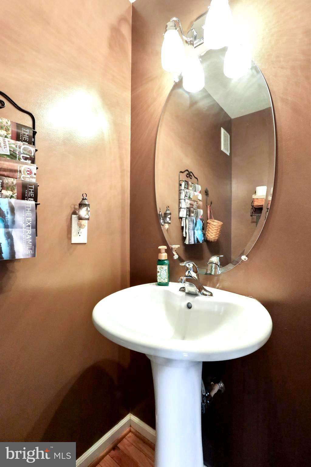 1147 Happy Ridge Drive Front Royal, VA 22630 - Photo 27 of 42 a bathroom with a sink and a mirror