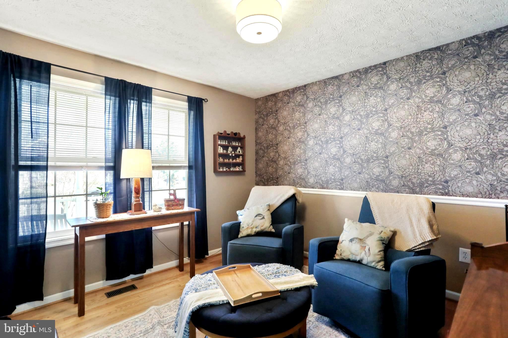 1147 Happy Ridge Drive Front Royal, VA 22630 - Photo 29 of 42 a living room with furniture and a fireplace