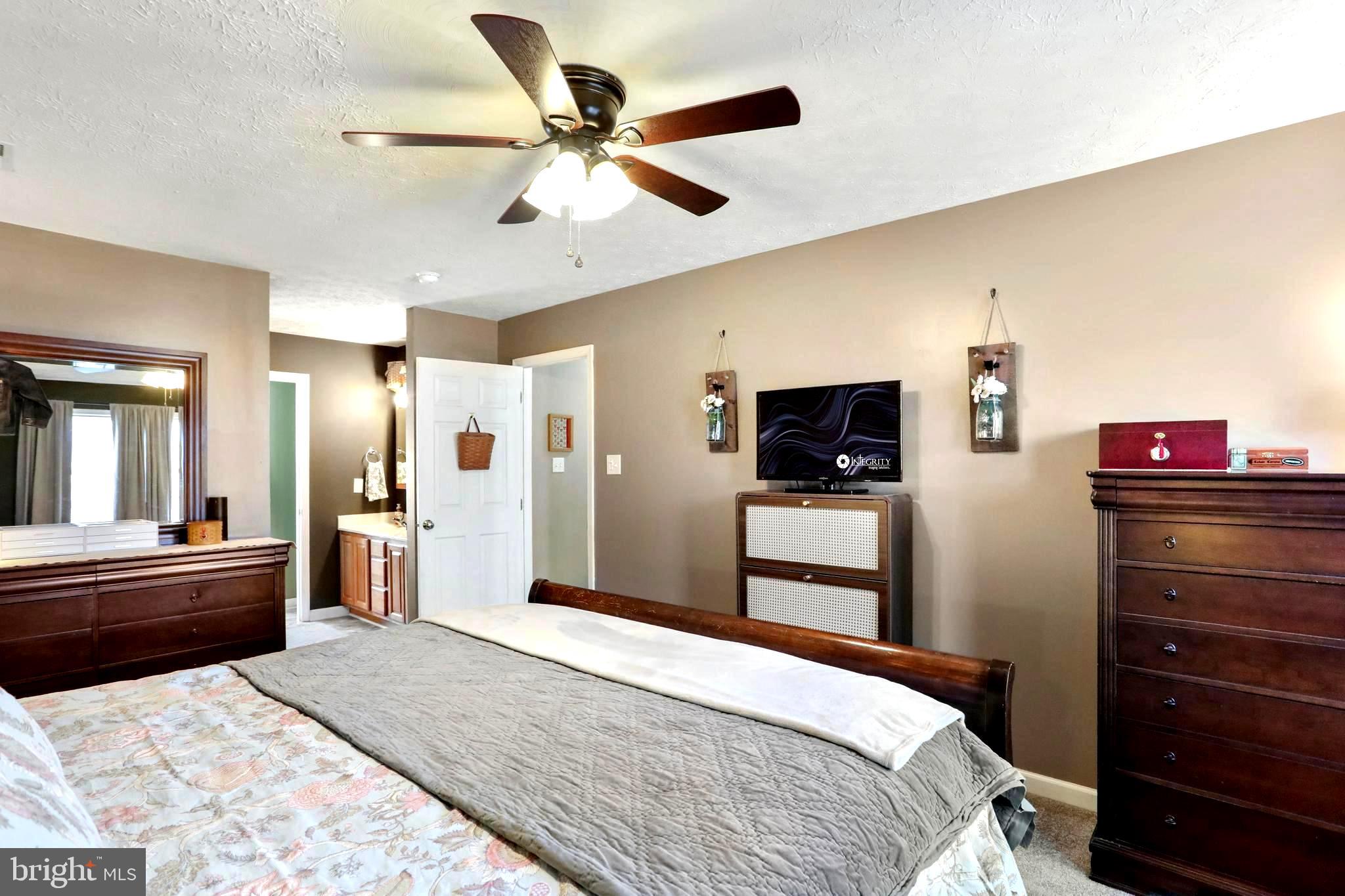 1147 Happy Ridge Drive Front Royal, VA 22630 - Photo 6 of 42 a bedroom with a bed and a television