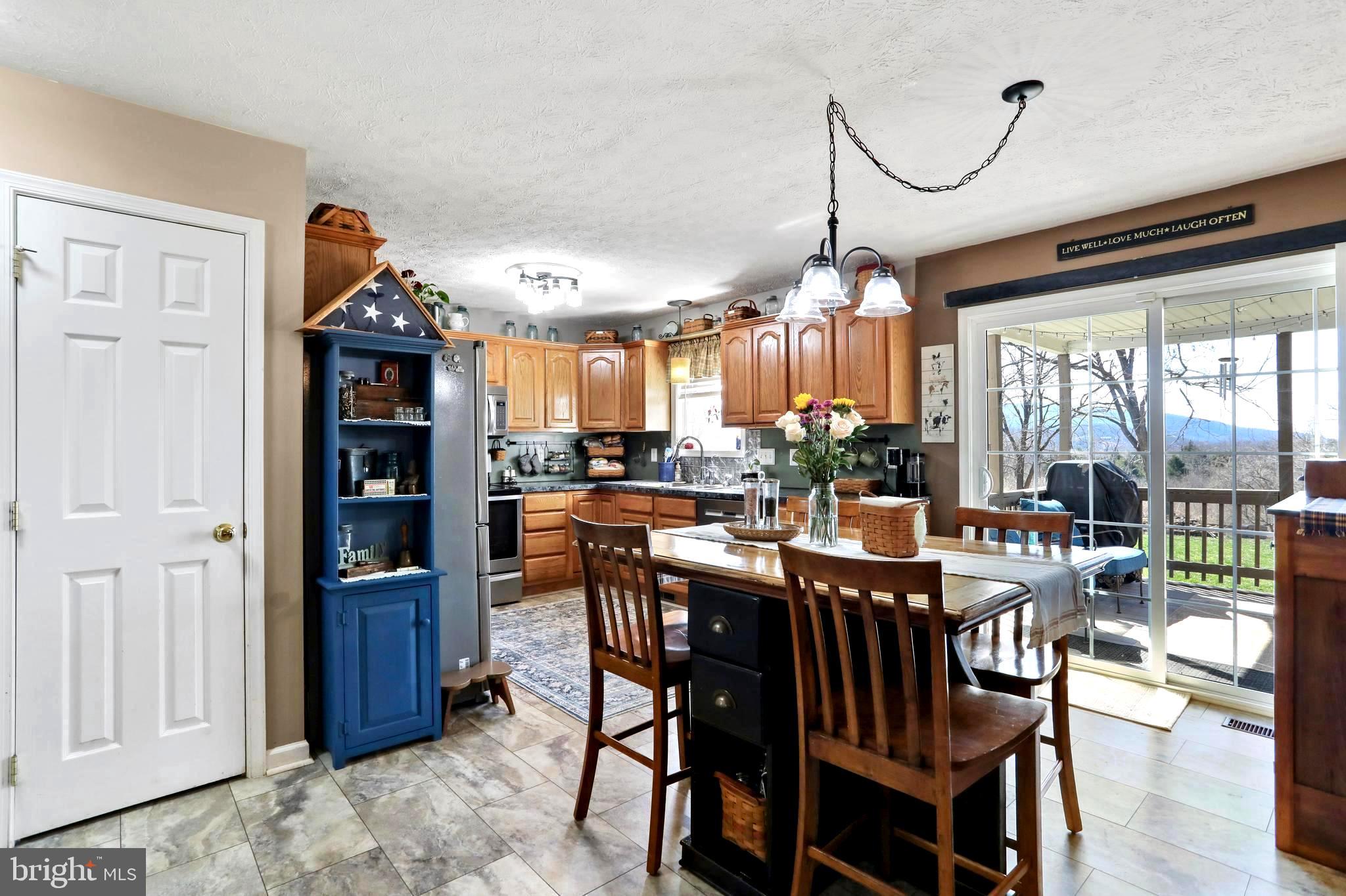1147 Happy Ridge Drive Front Royal, VA 22630 - Photo 10 of 42 a view of a dining room with furniture window and wooden floor
