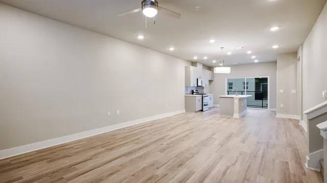 a view of kitchen with wooden floor