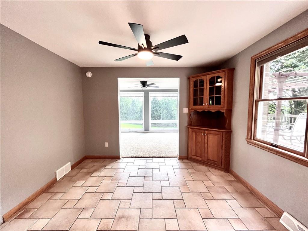 475 Bradys Ridge Road Beaver, PA 15009 - Photo 12 of 38 a view of empty room with window and ceiling fan