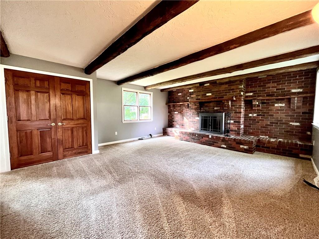 475 Bradys Ridge Road Beaver, PA 15009 - Photo 14 of 38 a view of an empty room with a fireplace