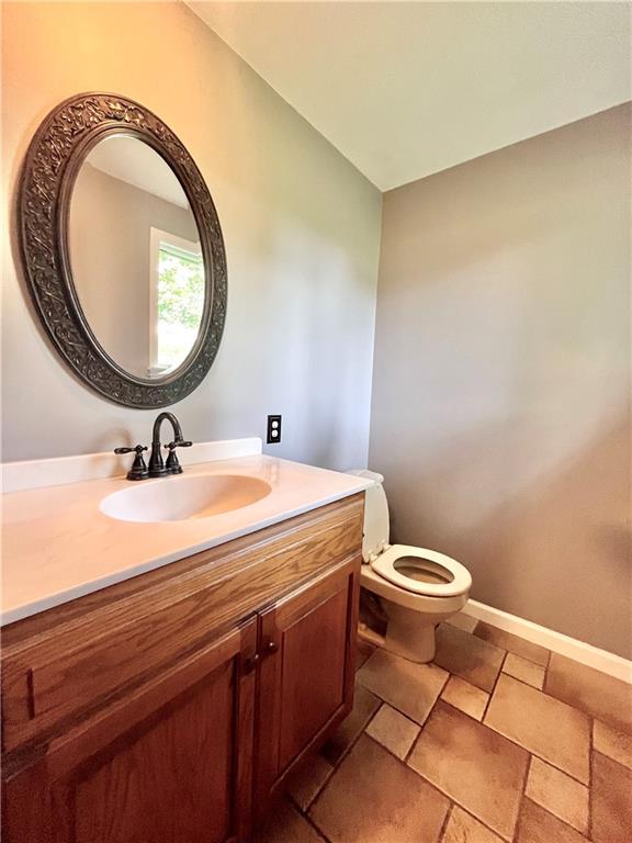 475 Bradys Ridge Road Beaver, PA 15009 - Photo 15 of 38 a bathroom with a sink a mirror and a toilet