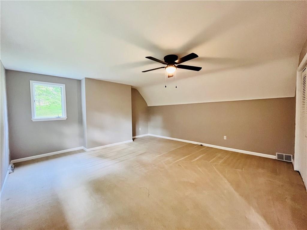 475 Bradys Ridge Road Beaver, PA 15009 - Photo 19 of 38 an empty room with a window and a ceiling fan
