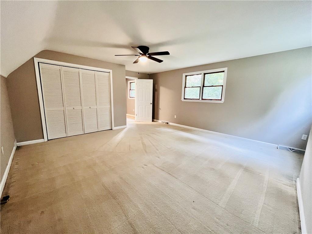 475 Bradys Ridge Road Beaver, PA 15009 - Photo 20 of 38 a view of a livingroom with a ceiling fan and window