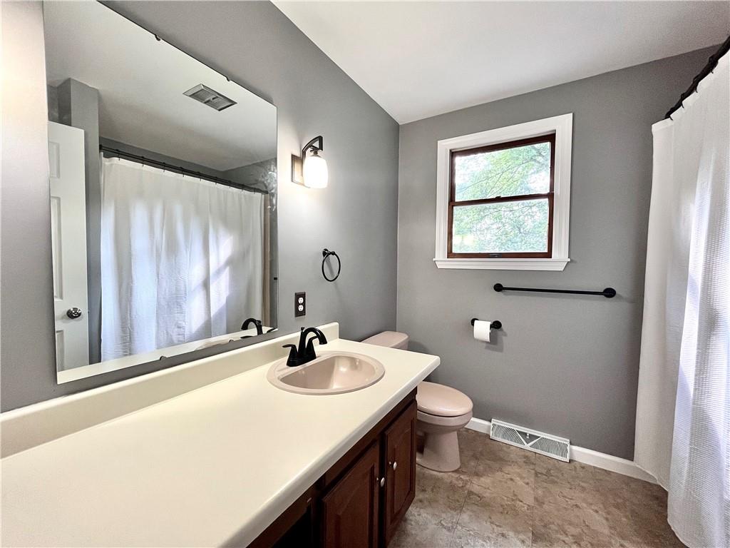 475 Bradys Ridge Road Beaver, PA 15009 - Photo 21 of 38 a bathroom with a sink and a mirror