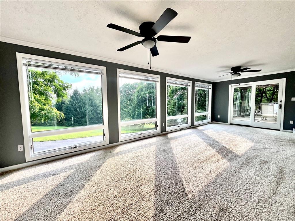 475 Bradys Ridge Road Beaver, PA 15009 - Photo 7 of 38 a view of an empty room with a balcony