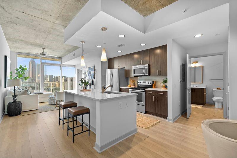 a large kitchen with a table and chairs in it