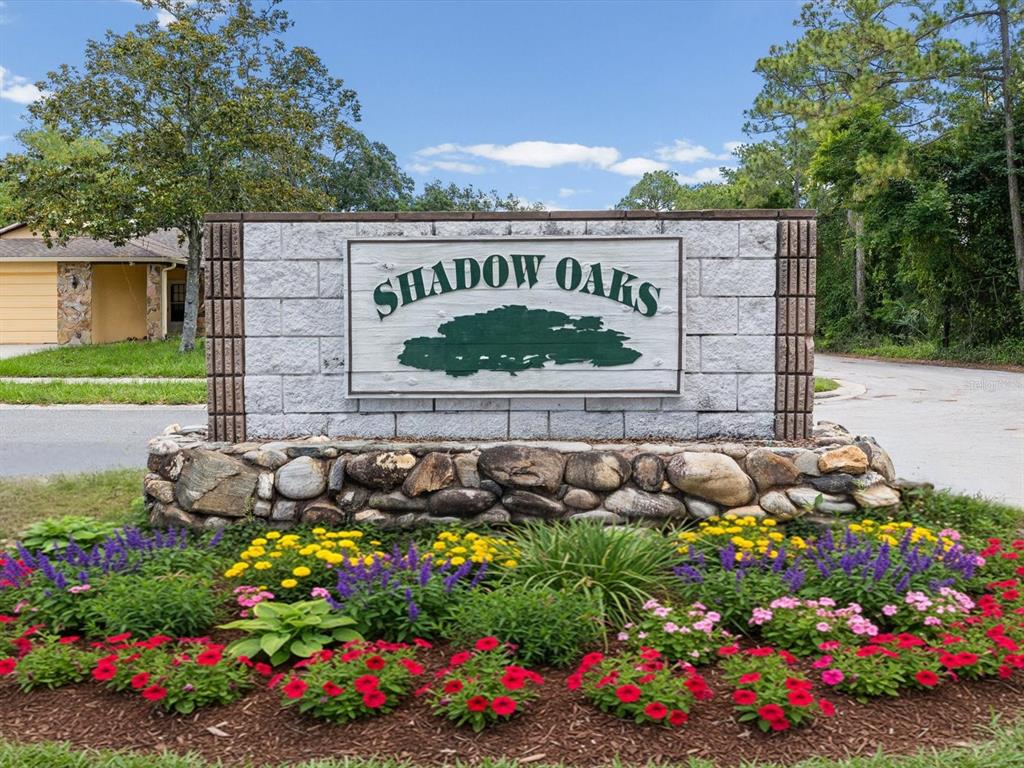 5904 Springrun Court Holiday, FL 34690 - Photo 7 of 53 a view of a sign board with buildings in the background
