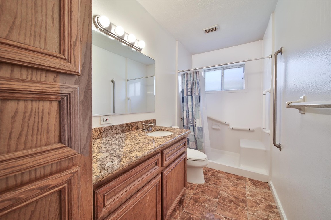 990 Redway Lane Houston, TX 77062 - Photo 19 of 21 a bathroom with a granite countertop sink and a mirror
