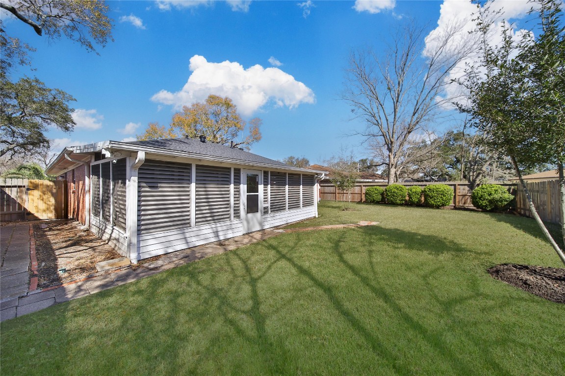 990 Redway Lane Houston, TX 77062 - Photo 5 of 21 a front view of a house with a yard