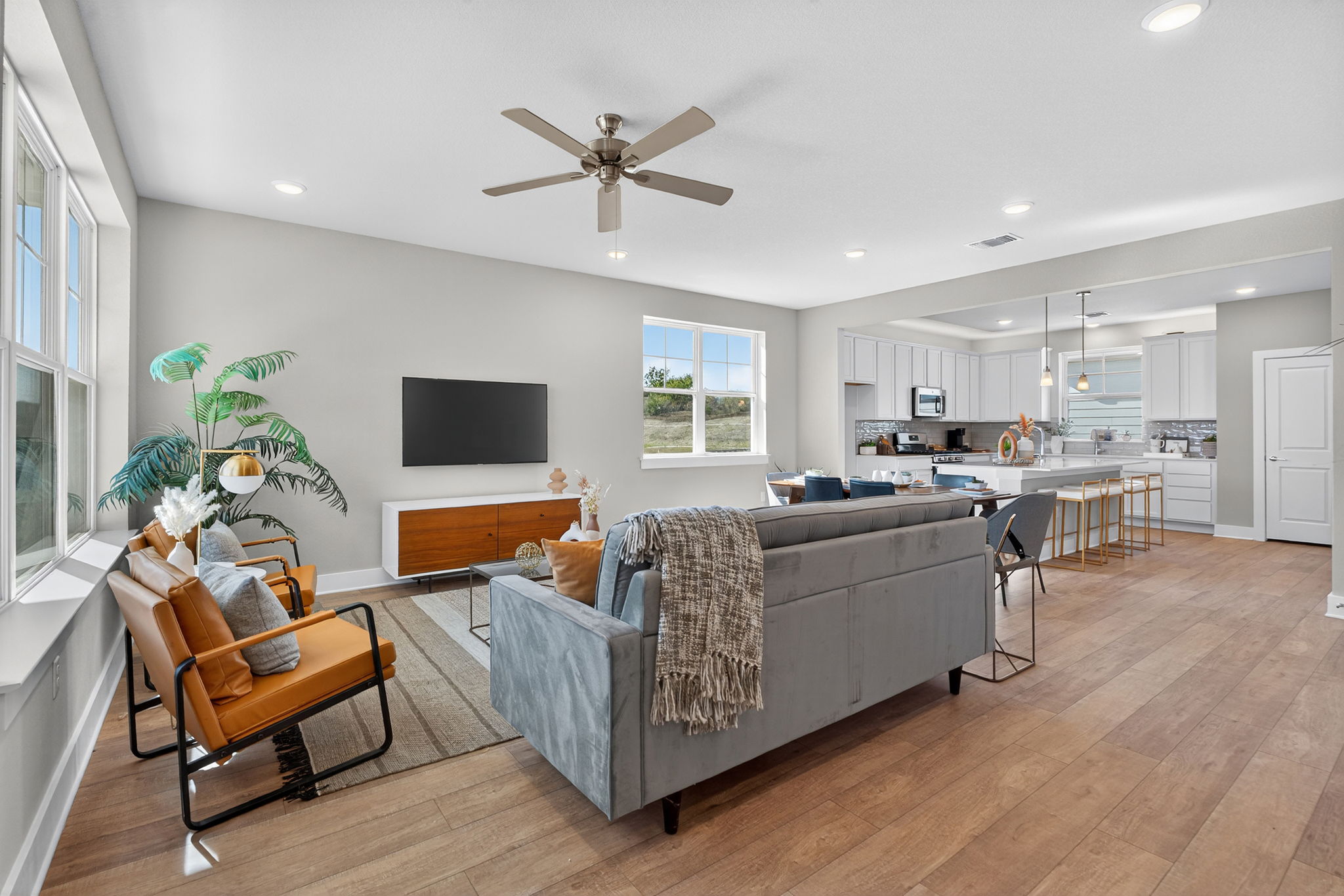 5902 Rotunda View Austin, TX 78747 - Photo 18 of 38 Living area featuring light wood finished floors, ceiling fan, plenty of natural light, and recessed lighting