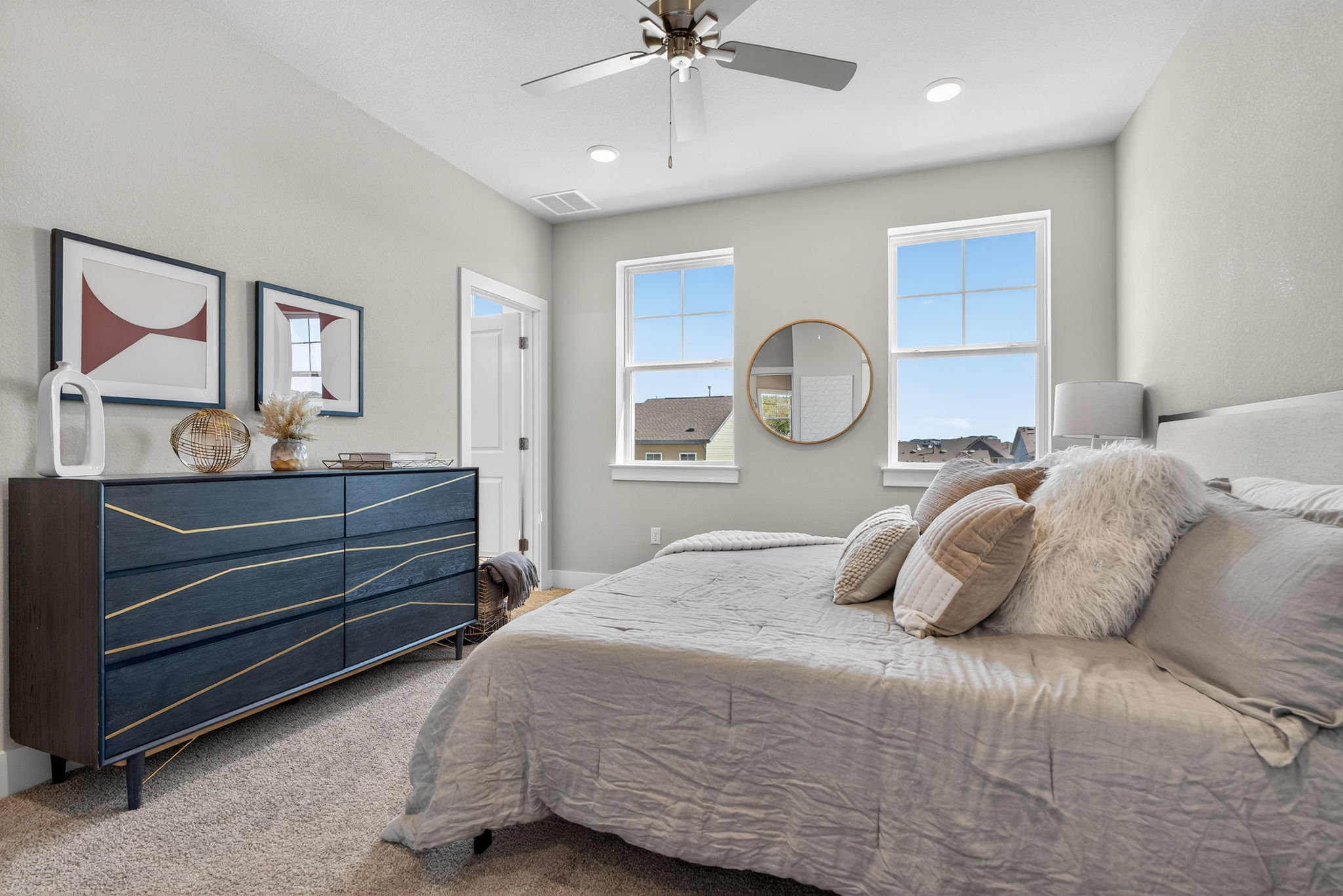 5902 Rotunda View Austin, TX 78747 - Photo 24 of 38 Bedroom featuring ceiling fan, carpet flooring, and multiple windows