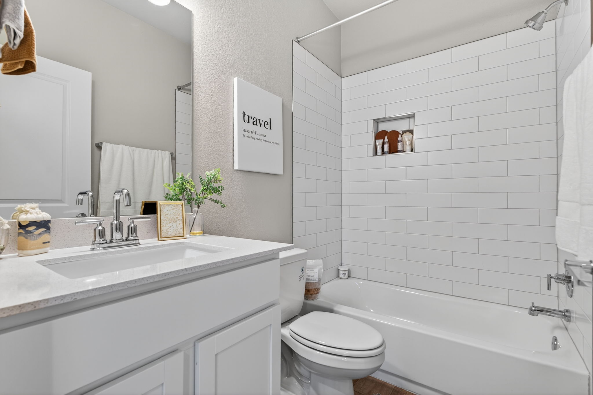 5902 Rotunda View Austin, TX 78747 - Photo 28 of 38 Bathroom with vanity, a textured wall, and bathing tub / shower combination