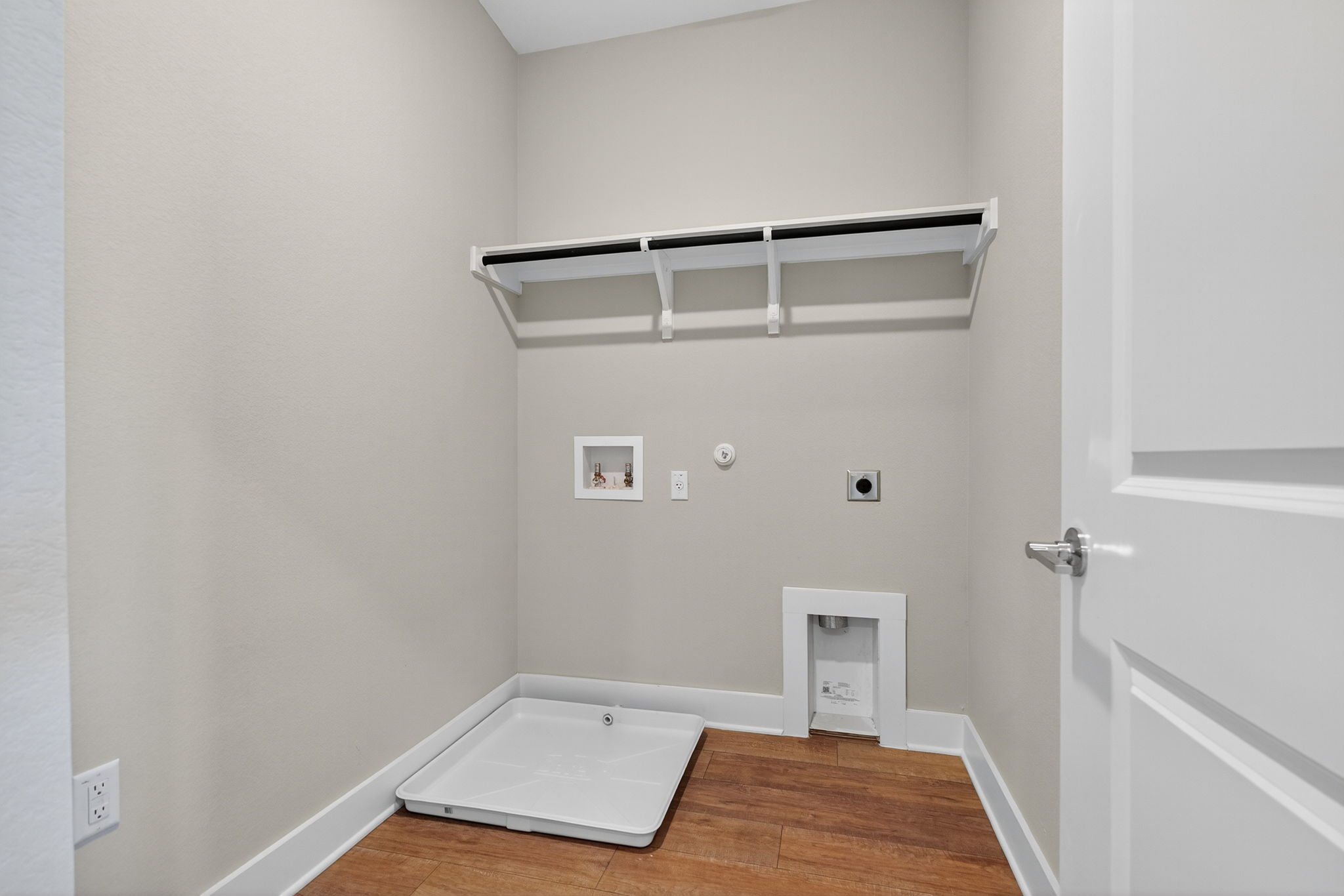 5902 Rotunda View Austin, TX 78747 - Photo 30 of 38 Laundry area featuring gas dryer hookup, wood finished floors, hookup for a washing machine, and hookup for an electric dryer