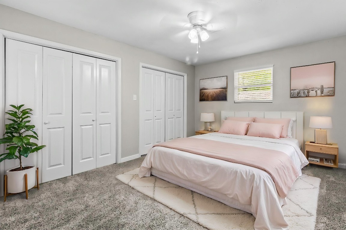 21 Red Oak Circle Point Blank, TX 77364 - Photo 25 of 50 a spacious bedroom with a bed and a potted plant