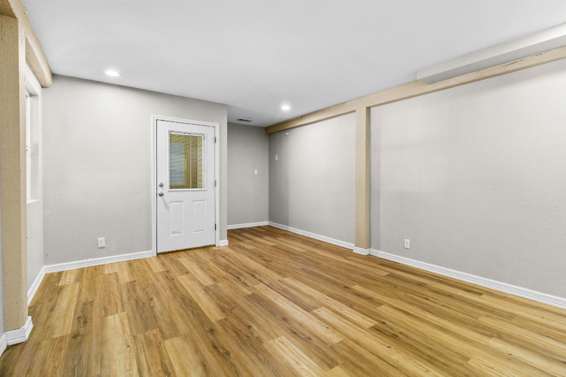 21 Red Oak Circle Point Blank, TX 77364 - Photo 27 of 50 a view of empty room with wooden floor and fan