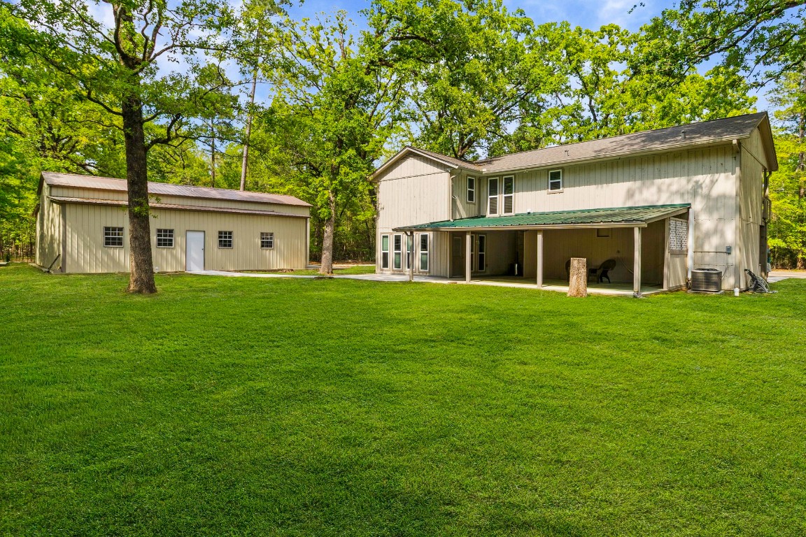 21 Red Oak Circle Point Blank, TX 77364 - Photo 33 of 50 a front view of house with yard and green space