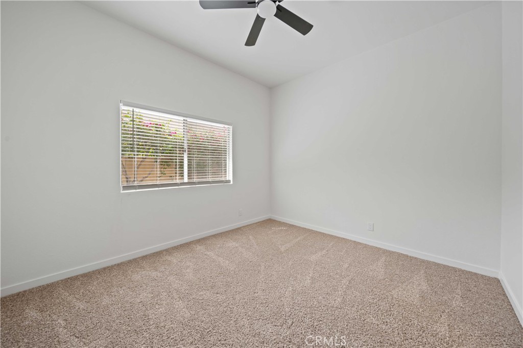 22 Oak Tree Drive Rancho Mirage, CA 92270 - Photo 11 of 25 an empty room with windows