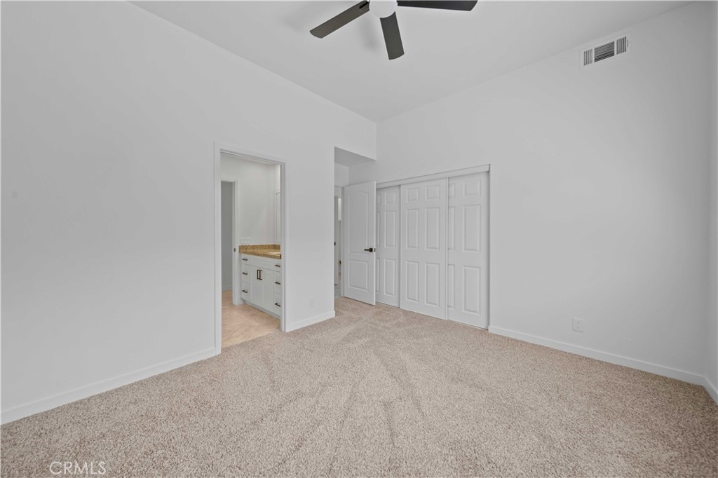 22 Oak Tree Drive Rancho Mirage, CA 92270 - Photo 12 of 25 an empty room with view of ceiling fan
